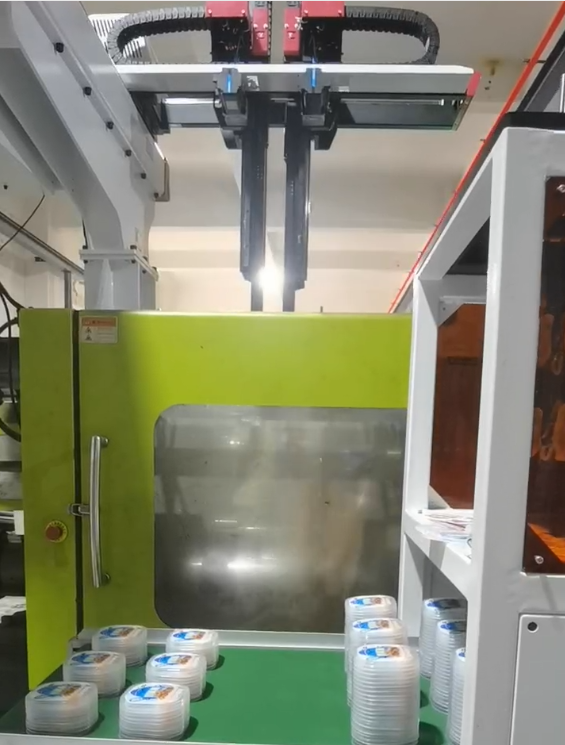 Top entry type in-mold labeling machine IML case application